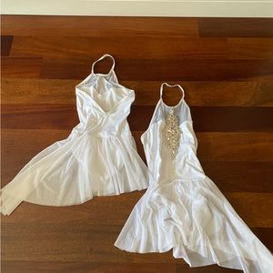 white leotard with skirt attached and jewels on the front. ballet costume